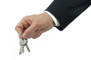 Man Holding House Keys