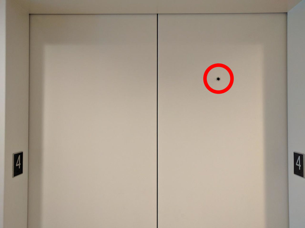 The Tiny Hole in Elevator Doors