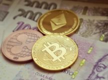 Different cryptocurrencies placed on currency notes