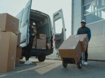 Delivery man unloading boxes